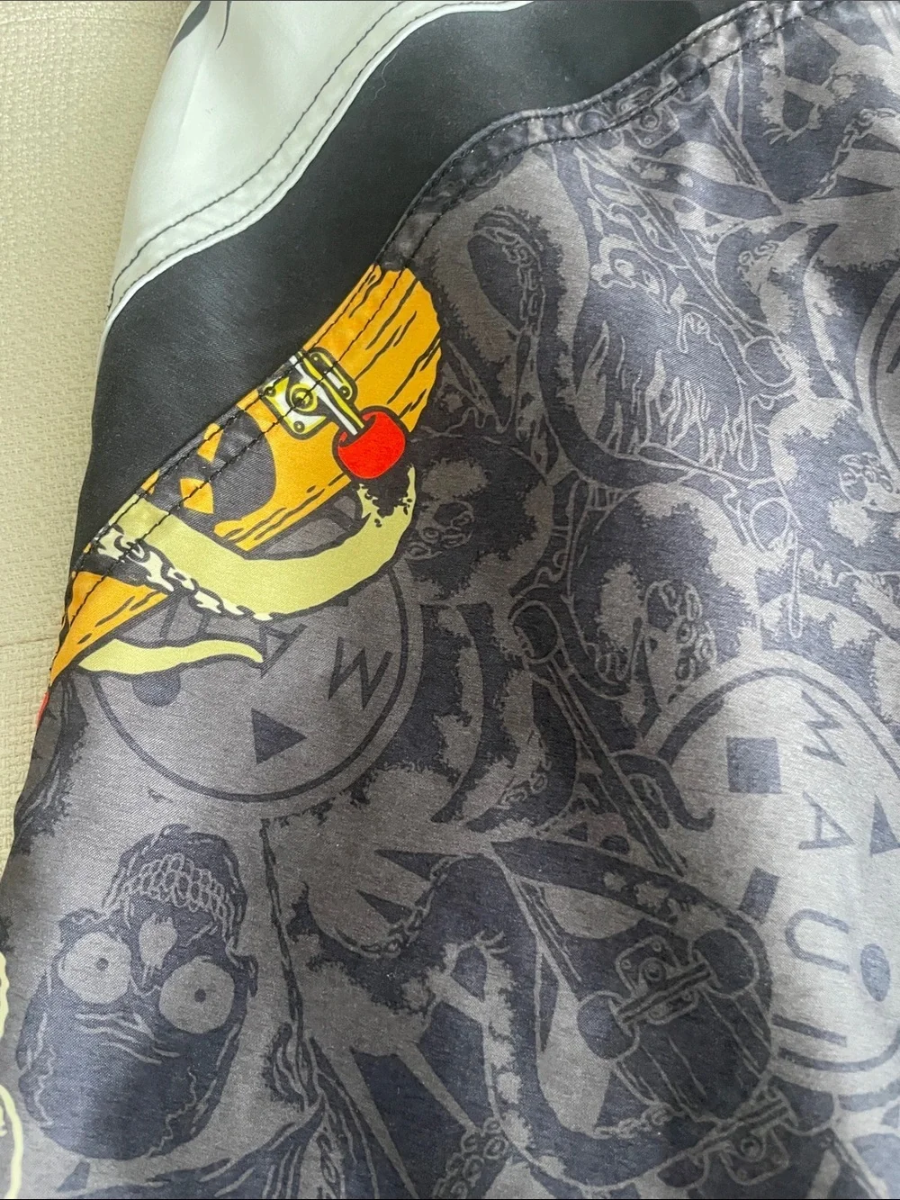 Maui and Sons Black Swim Shorts with Red & Yellow Skull Graphic